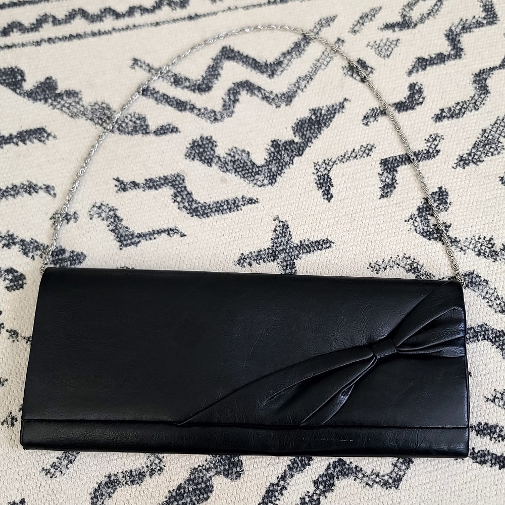 Vintage leather clutch with metal strap